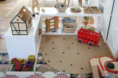 a play room with toys and furniture in it