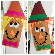 two paper bags with faces made to look like scarecrows