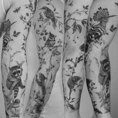 two people with tattoos on their arms and legs