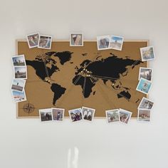 a cork board with many pictures on it and a world map in the middle one