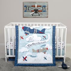 a baby crib bedding set with an airplane theme