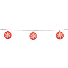 red and white ornaments hanging from a string