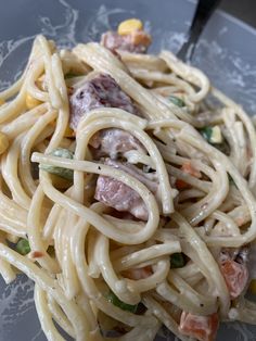 a close up of a plate of food with noodles