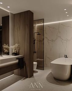 a bathroom with a large white tub next to a sink