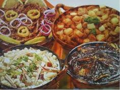 several different types of food in bowls on a table