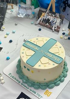 a cake with a cross on it sitting on a table