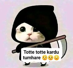 a cat in a black outfit holding a stick with two emoticions on it