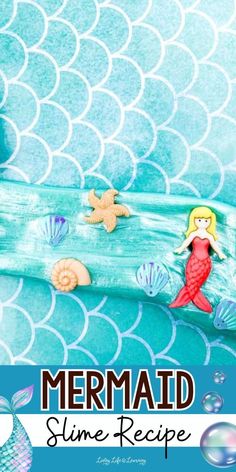 the mermaid bedding is made with blue and white sheets, under an aqua - green background