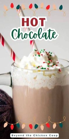 a hot chocolate drink with whipped cream and candy canes