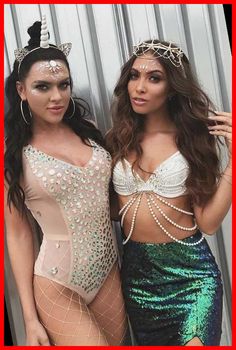 two women in bodysuits posing for the camera with one wearing a tiara