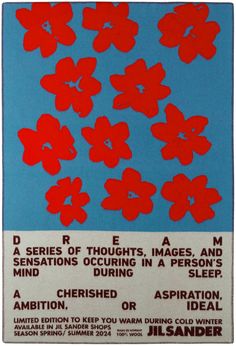 a poster with red flowers on blue background