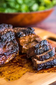 some meat is sitting on a cutting board