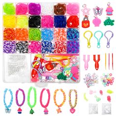 a box filled with lots of different types of bracelets and hair clips on top of a white surface