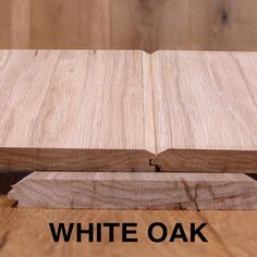 two pieces of wood sitting next to each other on top of a wooden floor with the words white oak