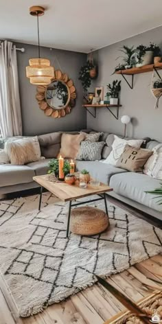 a living room filled with lots of furniture and decor on top of a wooden floor