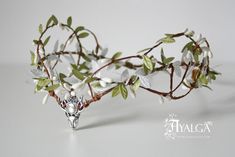 We love making forest headpieces with an elvish look. This crown is one of our deer creations , we love how this beautiful animal looks on the center with the color gem you like the most . There are some acrilyc rhinestones options and magical stones like amethyst or moonstone . Our woodland crowns can be custom with crystal drops , different leaves or berries color , adding more chains or any little change on it We will be happy to make your dream head piece . Send us a convo with your idea . A Boho Tiara, Festival Crown