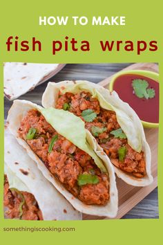 fish pita wraps on a cutting board with sauce