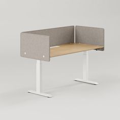 an office desk with two cubicles on each side and a white frame around it