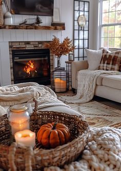 a living room filled with furniture and a fire place in the middle of the room