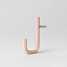 a wooden object that looks like a letter j