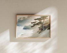 a painting hanging on the wall next to a window with sunlight coming in through it