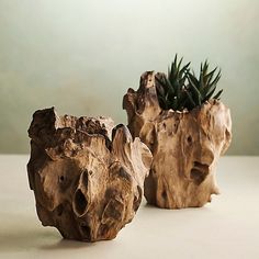 two planters made out of wood on a table