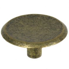 an antique brass cabinet knob on a white background