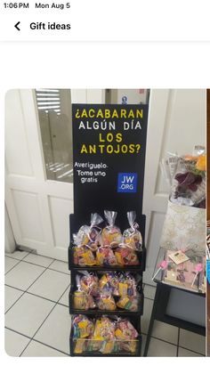 an image of a display in a store with food on the shelf and other items for sale