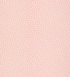 a pink background with white polka dots