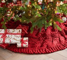 presents under the christmas tree are wrapped in red and white