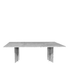 a white table sitting on top of a wooden floor