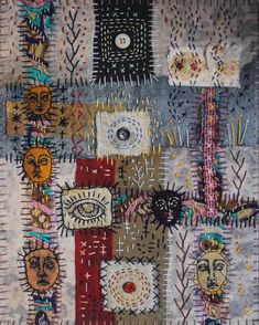 an abstract painting with many different faces and shapes on the fabric, including one eye