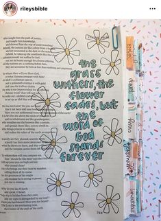 an open bible with flowers and the words, this verse is written in blue ink