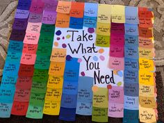 a bulletin board that has been decorated with colorful papers and writing on it, which says take what you need