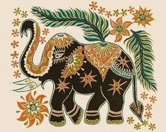 an elephant with flowers and leaves on it's back