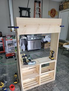 the workbench is made out of wood and has tools on it