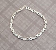 Beautiful vintage minimalist silver tone infinity bracelet by Avon. GENERAL DESCRIPTION  Vintage Bracelet Color: Silver Tone Brand: Avon Bracelet Length: 8 Inches Last photo includes measurements of bracelet If you have any questions please feel free to message me! Vintage Bracelet, Bracelet Vintage, Vintage Bracelets, Chain Link Bracelet, Infinity Bracelet, Link Bracelets, Arm Band, Vintage Silver, Chain Link