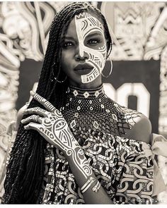 an image of a woman with face paint on her face and the caption below