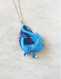 Blue Teardrop Resin Jewelry, Handmade Ocean-inspired Round Pendant Jewelry, Handmade Blue Teardrop Jewelry, Handmade Ocean-inspired Jewelry As Gift, Handmade Ocean-inspired Jewelry Gift, Blue Pendant Jewelry With Lobster Clasp, Blue Pendant Necklace With Lobster Clasp, Hand Painted Blue Round Pendant Necklace, Blue Hand Painted Round Pendant Necklace