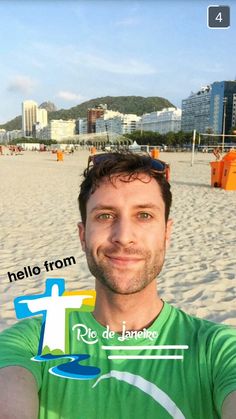 a man is taking a selfie on the beach with his cell phone in front of him