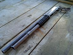 a metal object laying on top of a wooden floor