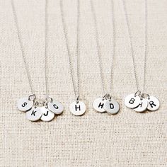 Hand stamped 3 letters onto circle tags! This sterling silver three initial hand stamped necklace makes the ideal gift. Stamp Necklace, Sterling Silver Initial Necklace, Coordinates Jewelry, Custom Initial Necklace, Round Tags, Hand Stamped Necklace, Sterling Silver Initial, Monogram Jewelry, Small Charms