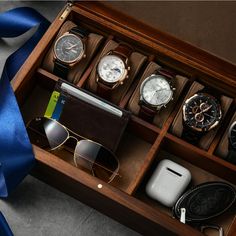 PREMIUM QUALITY: Made of highly durable and natural Acacia wood, the Shanik watch box is a well crafted and luxury organizer that will serve you for ages. Being covered with smooth and soft velvet inside, it's easy to clean and pleasant to the touch. LARGE STORAGE INSIDE: This capacious watch storage box features 5 separate slots to keep different types of watches, 1 large slot for things like wallet, glasses, phone, and 1 medium slot for smaller things such as AirPods, keychain, and other belon Watch Box For Men, Wood Organizer, Wood Watch Box, Personalized Watch, Mens Watch Box, Watch Organizer, Personalized Watches, Watch Storage Box, Watch Holder