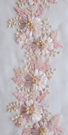 pink and white flowers with pearls on the bottom are shown in this embroidery work pattern