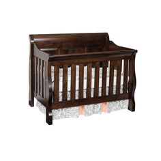 a baby crib that is brown and white