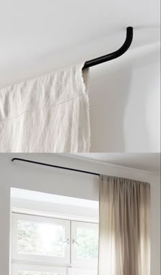 the curtain rod is hanging from the ceiling in front of the window and behind it are curtains