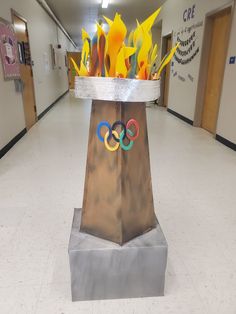 the olympic symbol is on display in an empty hallway