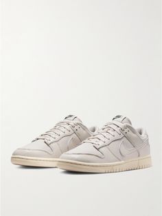 This version of Nike's iconic 'Dunk Low' sneakers is made from panels of leather and canvas in a tonal colour palette. Modelled on the original design, fans of the shoe will note the basketball-inspired soles and low-cut, padded collars. A coordinating 'Swoosh' logo rounds everything off nicely. Nike Dunks Low, Nike Collection, Dunks Low, Round Logo, Sneakers For Men, Swoosh Logo, Retro Sneakers, Nike Dunk Low, Low Sneakers