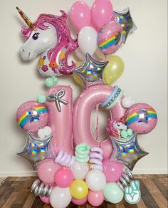 a unicorn balloon centerpiece with balloons and other decorations