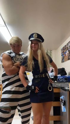 two people dressed in jail clothes standing next to each other